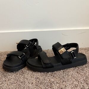 Black velcro adjustable sandals. Size 8 only worn once.